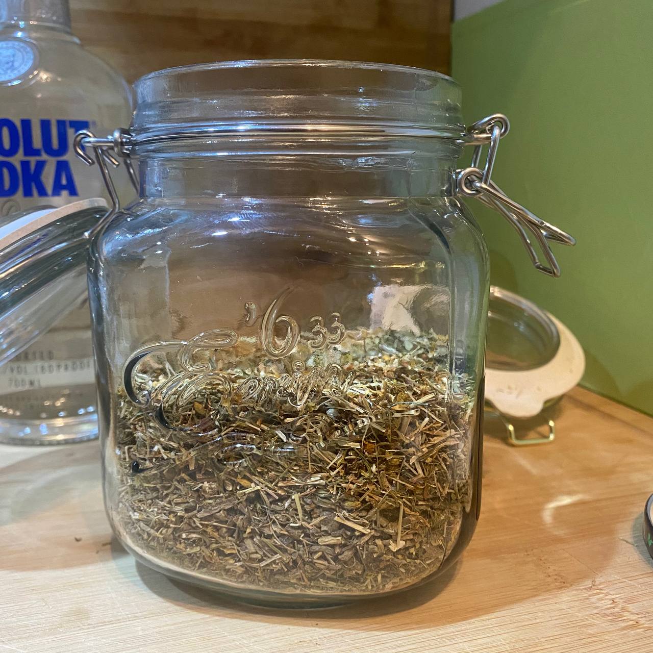 Herbs added to a large mason jar